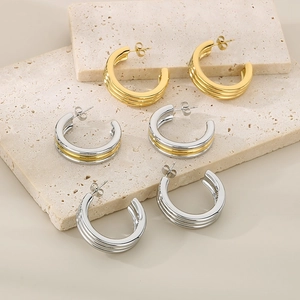 Minimalist C-shaped triple layer stainless steel hoop earrings in gold and silver finishes