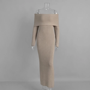 Detail of off-shoulder knitted dress showing the elegant ribbed texture and fold-over neckline