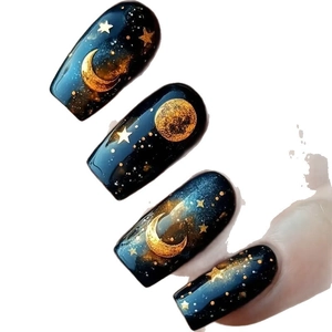 Starry night press-on nails with deep blue gradient and golden celestial patterns