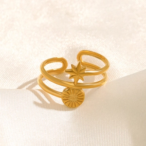 Minimalist double-layered gold stainless steel open ring with North Star and sunburst charms