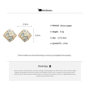 Detailed spec view of geometric square earrings with colorful zircon and silver pins