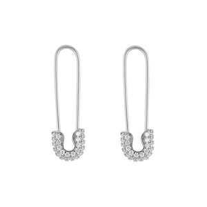 Detailed macro view of silver safety pin earrings with sparkling zircon micro-paving