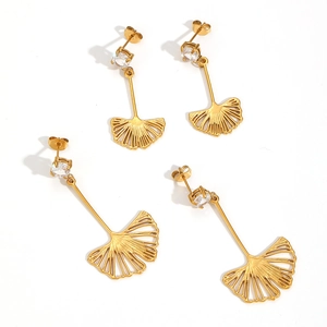 Elegant gold ginkgo leaf dangle earrings with sparkling zircon studs on white background