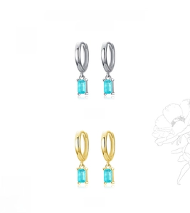 Detailed view of square blue gemstone earrings in silver and gold plating options