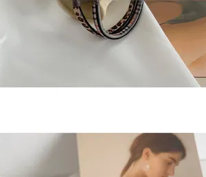 Macro detail of high-elasticity hair ties featuring leopard print and striped fabric texture