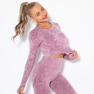 Detail of grey-pink acid-wash seamless yoga set featuring long sleeve crop top and leggings