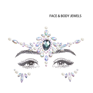 Detailed view of iridescent face jewels with teardrop rhinestones on eye line art