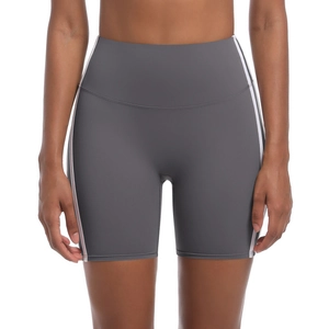Detail view of high waist yoga shorts in dark grey with side stripes and slim fit design