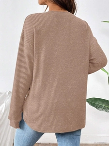 Detailed back view of a camel rib-knit long sleeve maternity shirt with soft texture