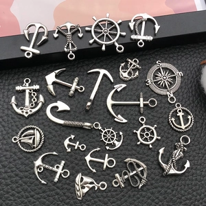 Vintage silver nautical charms collection featuring anchors, rudders and compass pendants