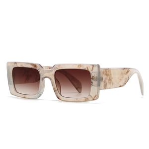 Retro square sunglasses with beige marble frames and brown gradient lenses