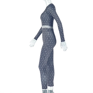 Detail of slim fit navy star print jumpsuit showing stretch fabric and side silhouette