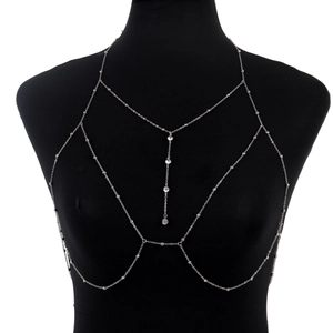 Detailed view of silver body chain with rhinestones on a professional black mannequin