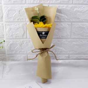Detail of sunflower and eucalyptus soap bouquet wrapped in kraft paper with twine