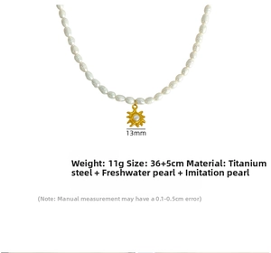 Detail of freshwater pearl necklace with 13mm sun pendant made of gold titanium steel