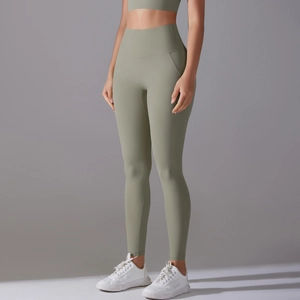 Detail view of high-waist fitness yoga shorts in olive green with seamless breathable fabric