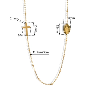 Gold French vintage cross and oval coin pendant necklace with size measurements on white