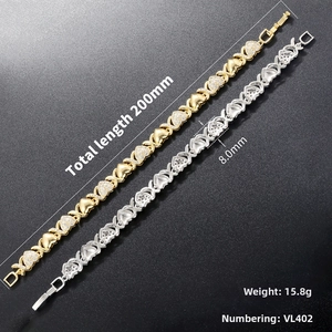 Detailed view of gold and silver heart-link bracelets with pave crystals and folding clasp