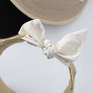 Women's summer wide brim straw sun hat with elegant fabric bow tie decoration