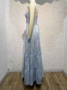 Detail of blue and white striped tiered summer maxi dress with adjustable straps