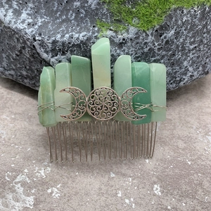 Handmade green crystal hair comb with silver Triple Moon Celtic knot design on mossy stone
