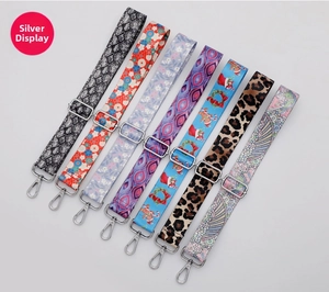 Detail of colorful patterned wide replacement straps with silver adjustable hardware