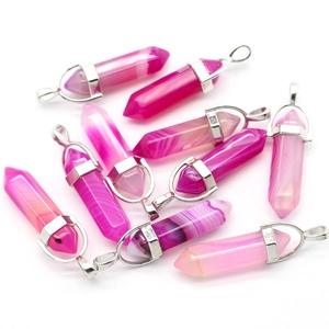 Close-up of ten hexagonal pink and white striped agate crystal pendants with silver bails