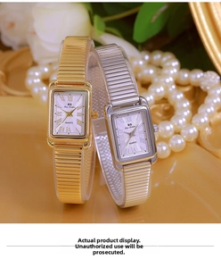 Detail of luxury rectangular quartz watches in gold and silver with Roman numeral dials