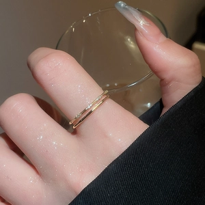 Detail of 18k gold plated double-layer ring with sparkling pave cubic zirconia accents
