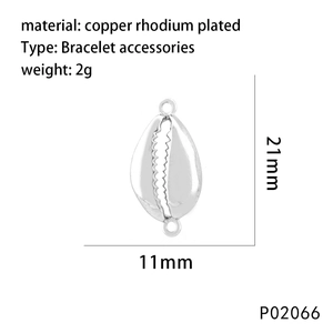 Detail view of shell pendant with dimensions 21mm by 11mm and copper rhodium material