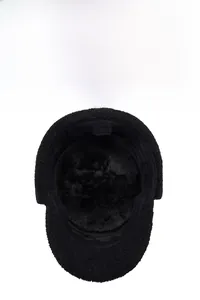 Detail view of the thick black fleece lining in the winter warm earflap cap
