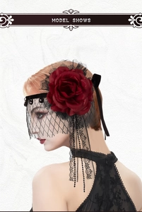 Detail of gothic red rose headpiece with black lace veil and beaded fringe for parties