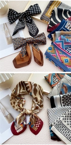 Détail de divers foulards en soie élégants à motifs avec différents nœuds et couleurs