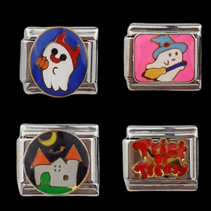 Detail of four Halloween charms including ghosts, haunted house, and Trick or Treat text