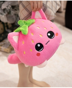 Close-up of plush pink strawberry cat toy with soft micro-fiber texture and embroidery