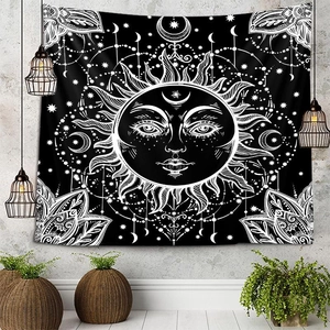 Detail of a mystical sun and moon tapestry hanging on a modern industrial wall