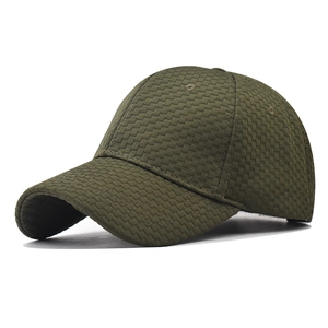 Detail of olive green baseball cap showing checkered woven texture and 6-panel structure