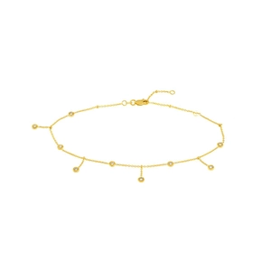 Close-up of gold anklet with round zircon charms and lobster clasp closure detail