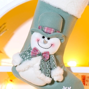 Green 3D snowman Christmas stocking with sequins and plush details for holiday decoration
