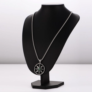 Retro compass star pendant necklace in silver stainless steel on a black jewelry bust