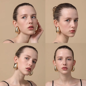 Detailed views of teardrop earrings in 18K gold finish on a model from various angles