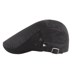 Detail of adjustable metal buckle and breathable mesh fabric on black summer newsboy cap
