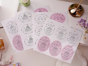 Macro view of happy birthday oval stickers on a decorative desk setup for gift packing