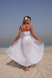 Detailed view of long white semi-transparent mesh beach cover-up on sea background