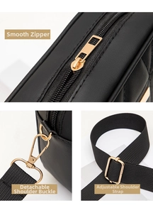 Detail view of premium black leather camera bag with smooth gold zipper and adjustable strap