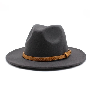 Detail of dark grey wool fedora hat featuring a brown snakeskin texture leather belt