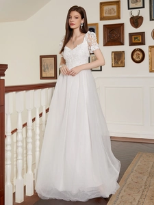 Elegant white lace V-neck evening gown with flowy layered mesh skirt for formal events