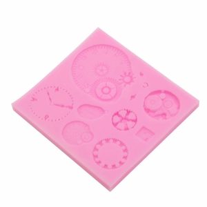 Pink silicone mold with clock faces and gears for steampunk fondant or resin crafts