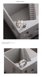 Detail of S925 sterling silver open ring with vintage gingerbread man and star motifs