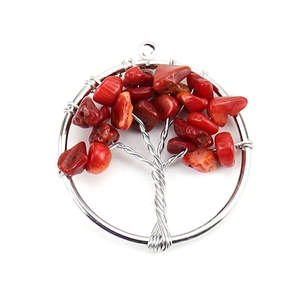 Detailed view of silver wire tree of life pendant with red coral stone leaves